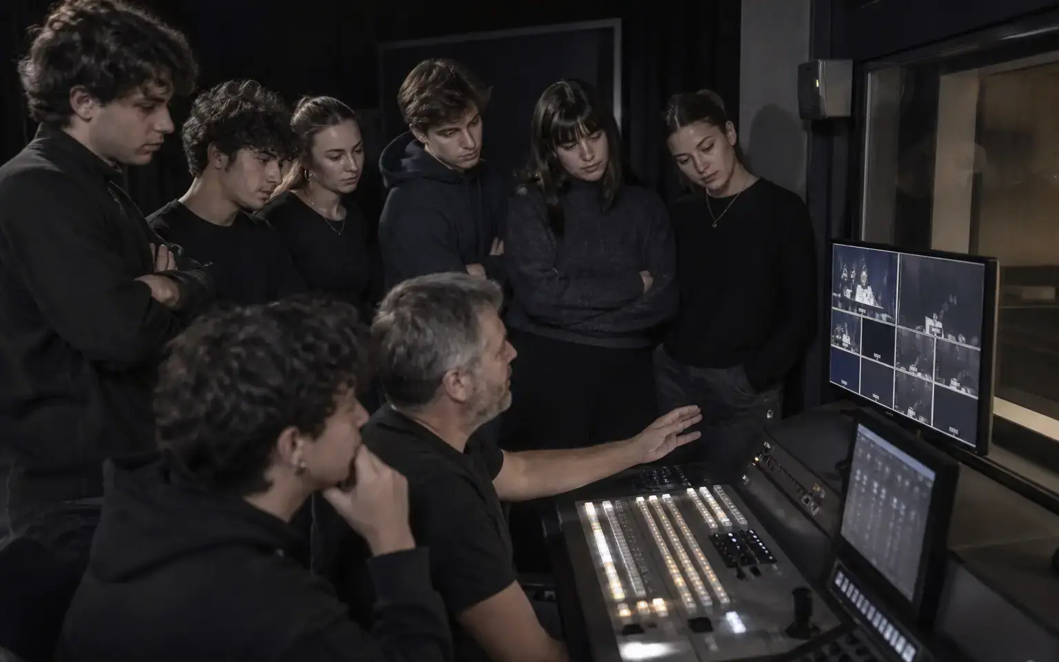 Emerging talent observing a live production desk
